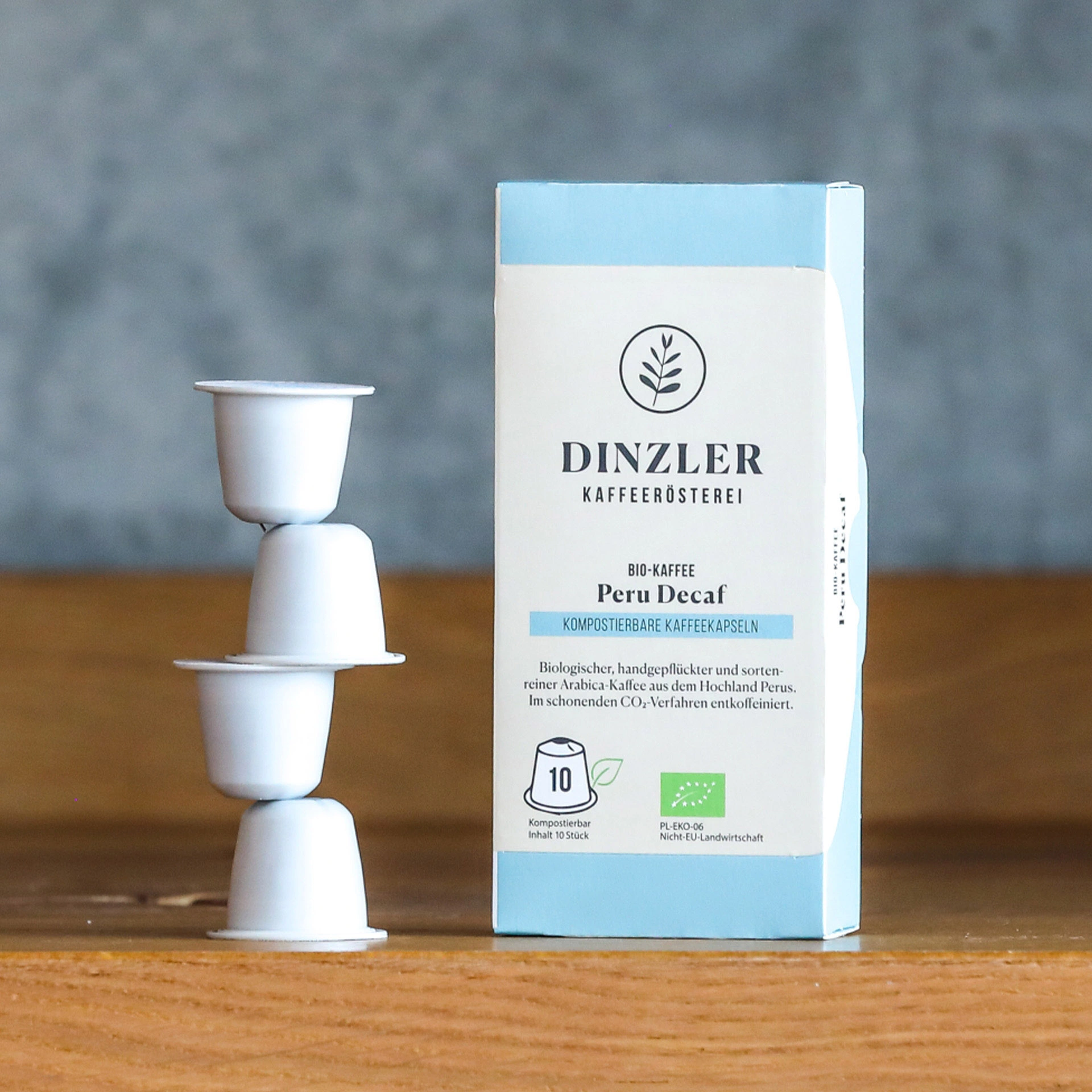 Szenebild DINZLER Bio Kapseln Kaffee Peru Decaf entkoffeiniert (Karton à 10 Kapseln)